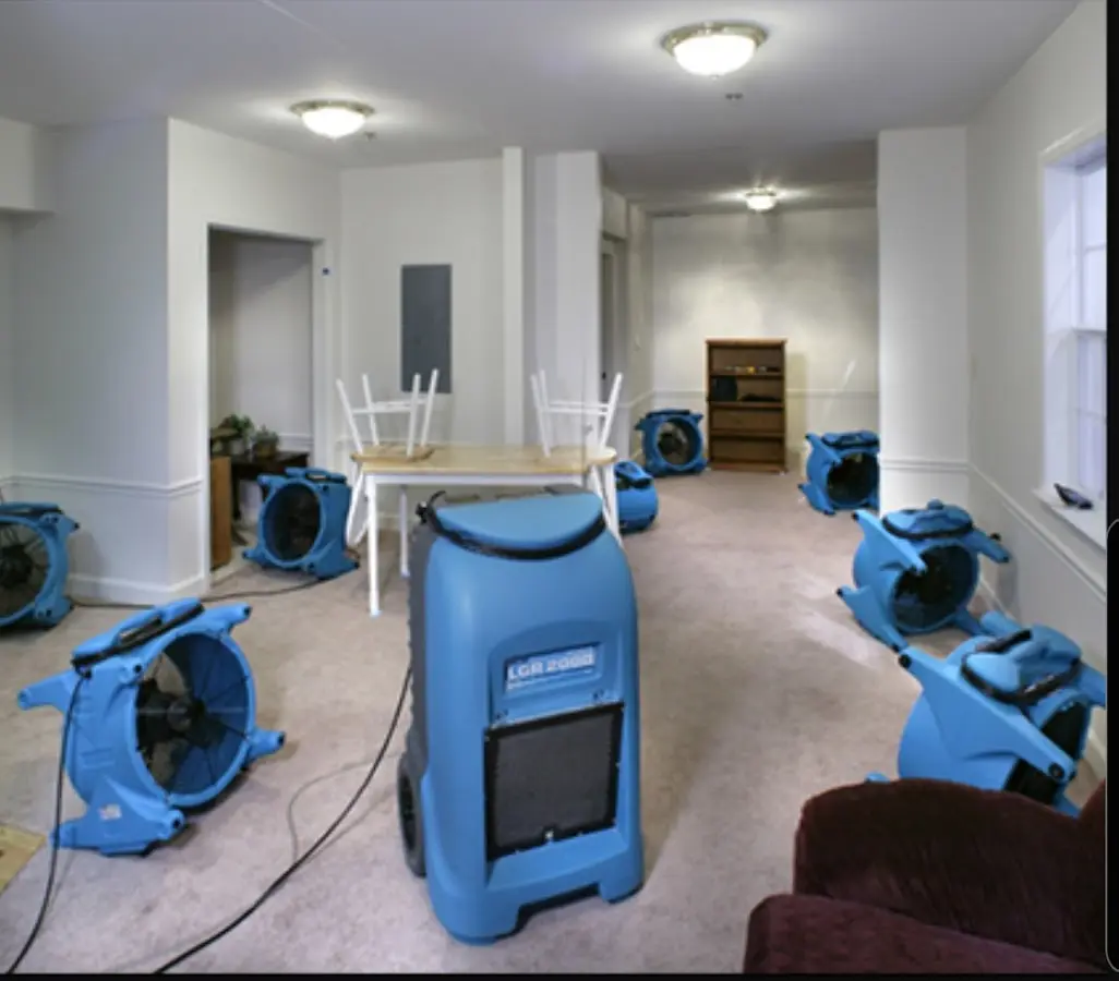 Air movers and dehumidifier setup for Water Damage Restoration in Hampden